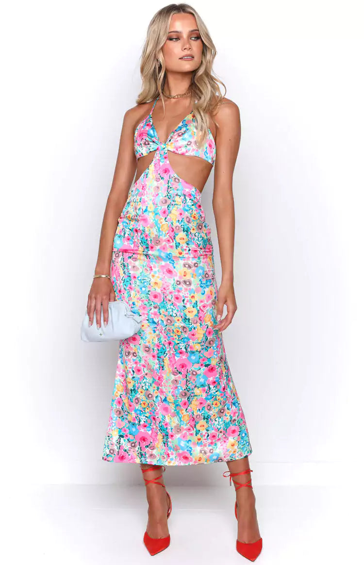 A model wearing a floral print midi dress.