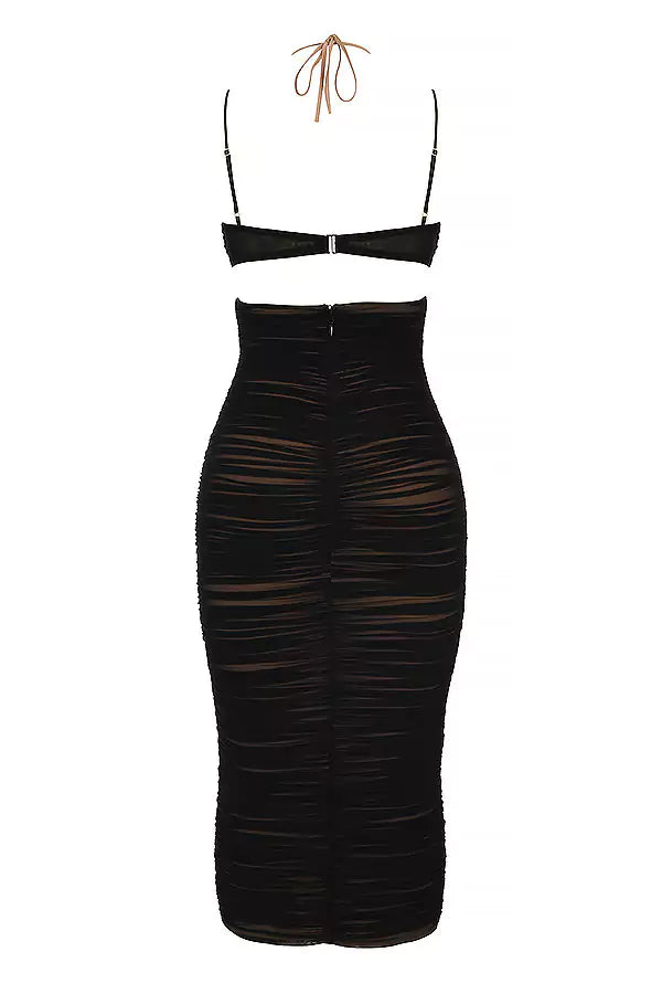 The back view of a black ruched midi dress.