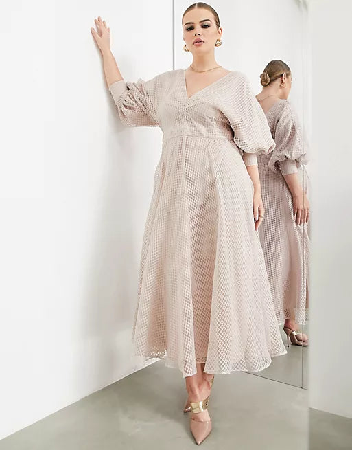 a woman wear a pink dress in backgroud mirror 
