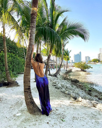 A woman wearing Adeola Blue Floral Semi Sheer Dress