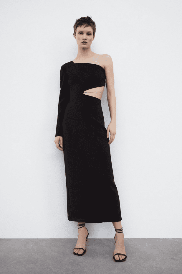 The model is wearing a black one shoulder dress.